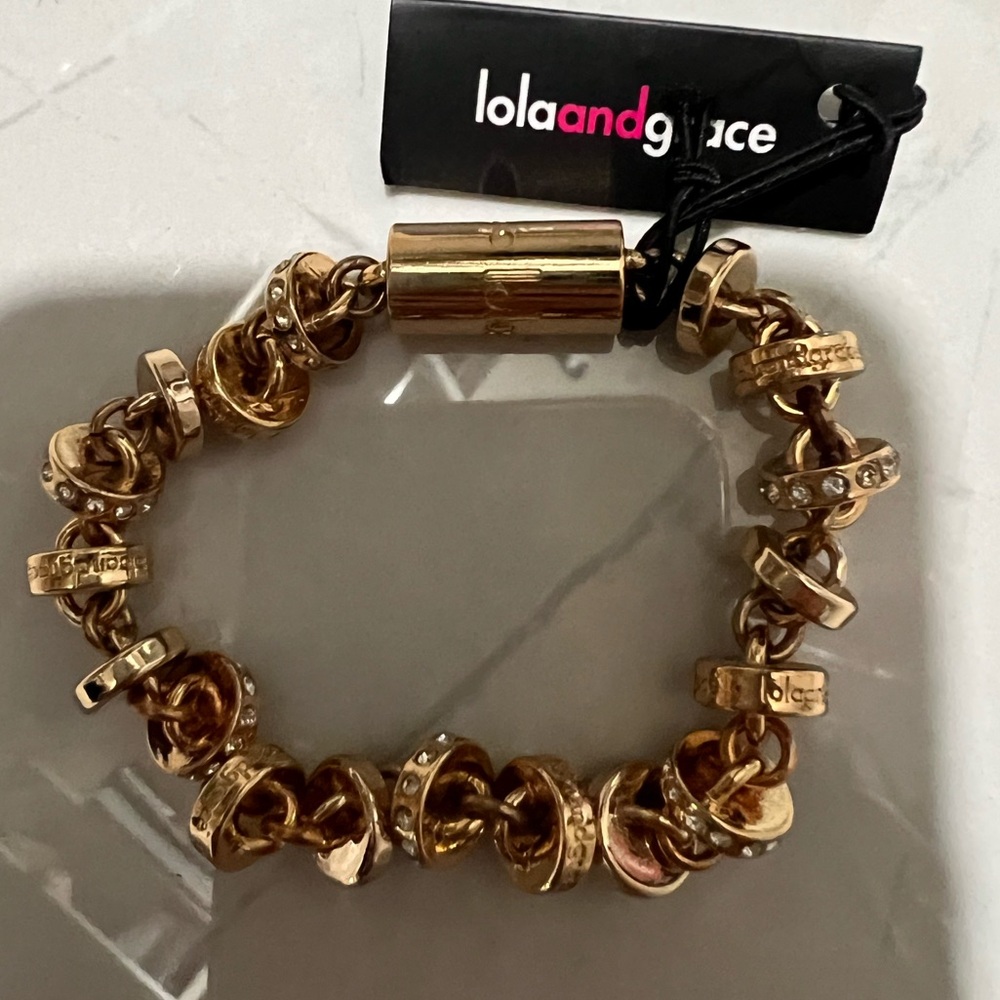 Gold and Swarovski bracelets from Lola and grace store.